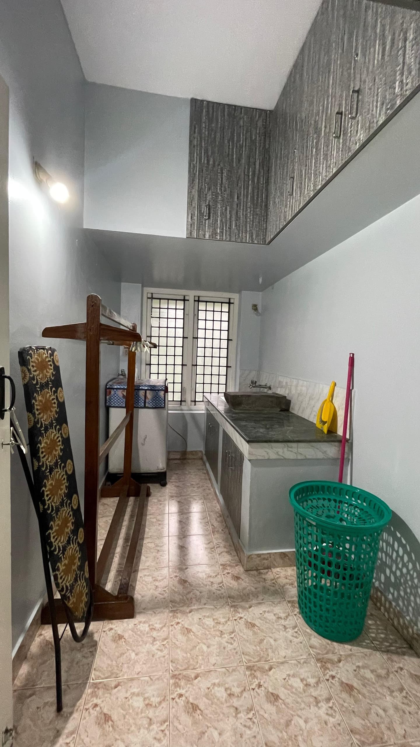 Utility and laundry area with washing machine